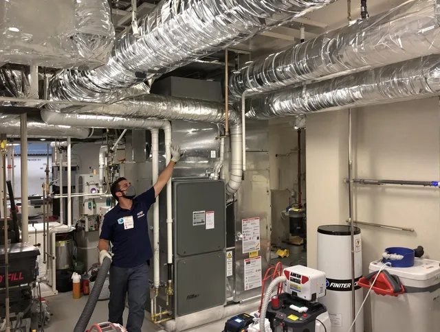 Foxborough Air Duct Cleaning specialist performing thorough furnace duct cleaning in a Foxborough residence