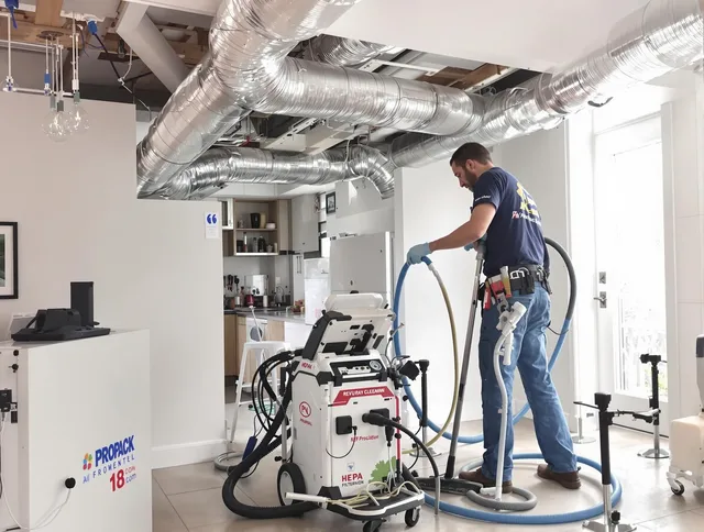Foxborough Air Duct Cleaning technician performing advanced pure duct cleaning with specialized equipment in Foxborough