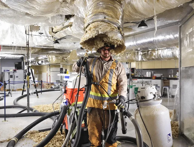 Professional vacuum insulation removal by Foxborough Air Duct Cleaning expert in Foxborough